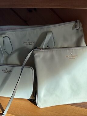 kate spade cream tote with matching pouch and wristlet